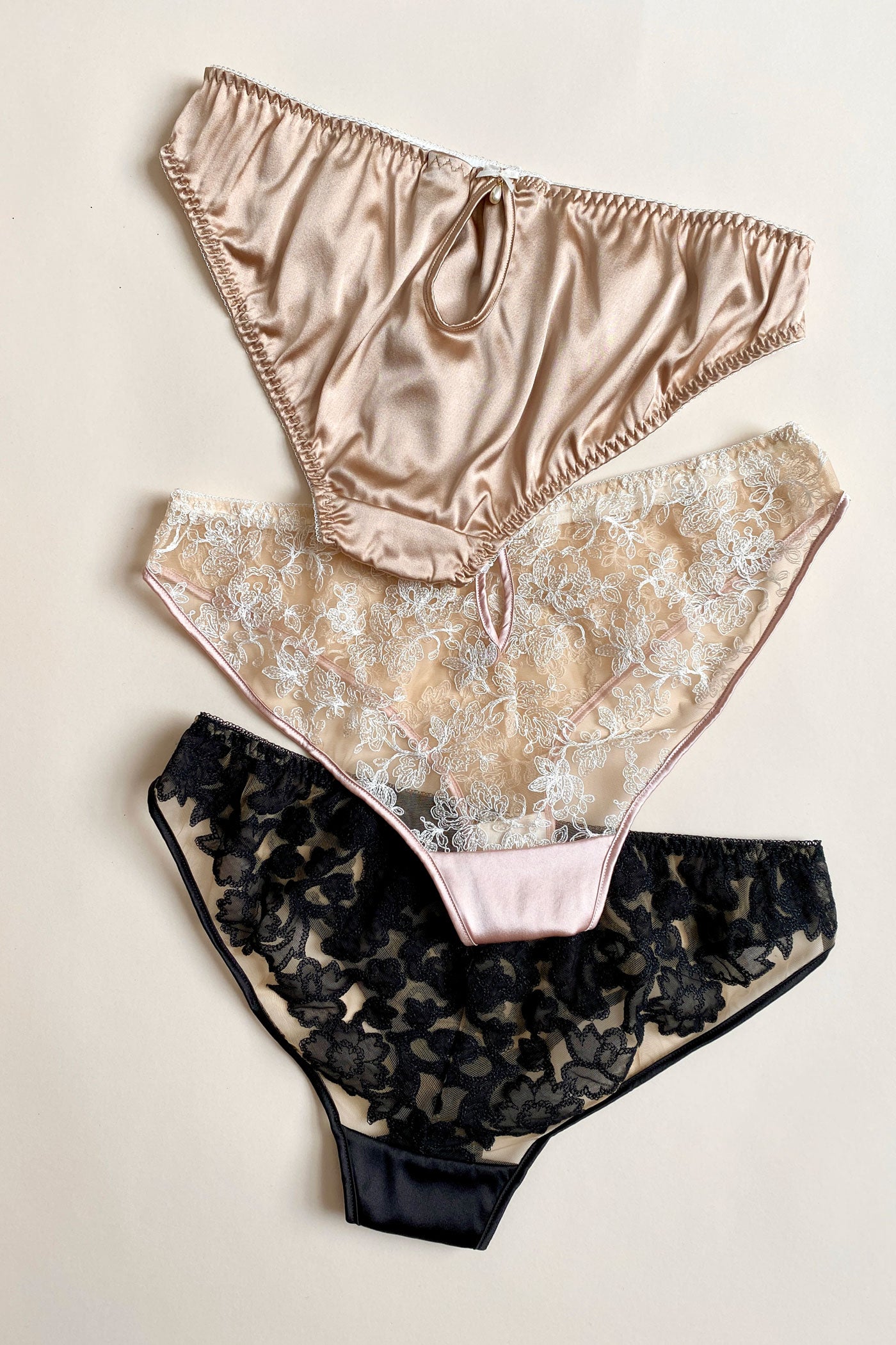 Back view of 3 pairs of sheer and silk panties 