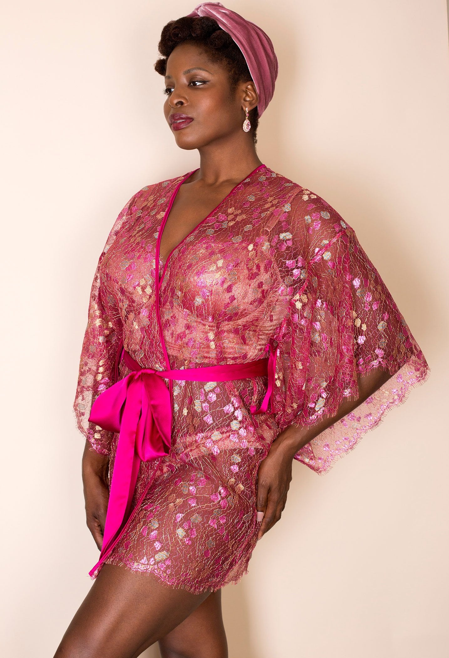 Sheer bright pink metallic lace robe with deep sleeves and pink silk belt
