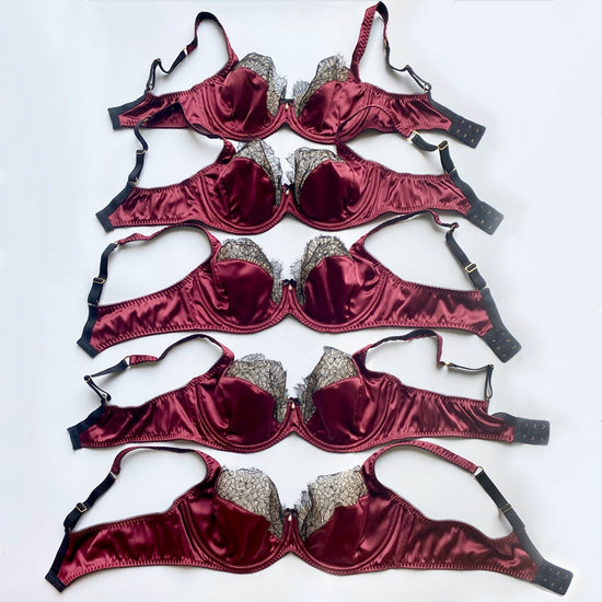 Multiple DD cup bra sizes lined up to show size difference