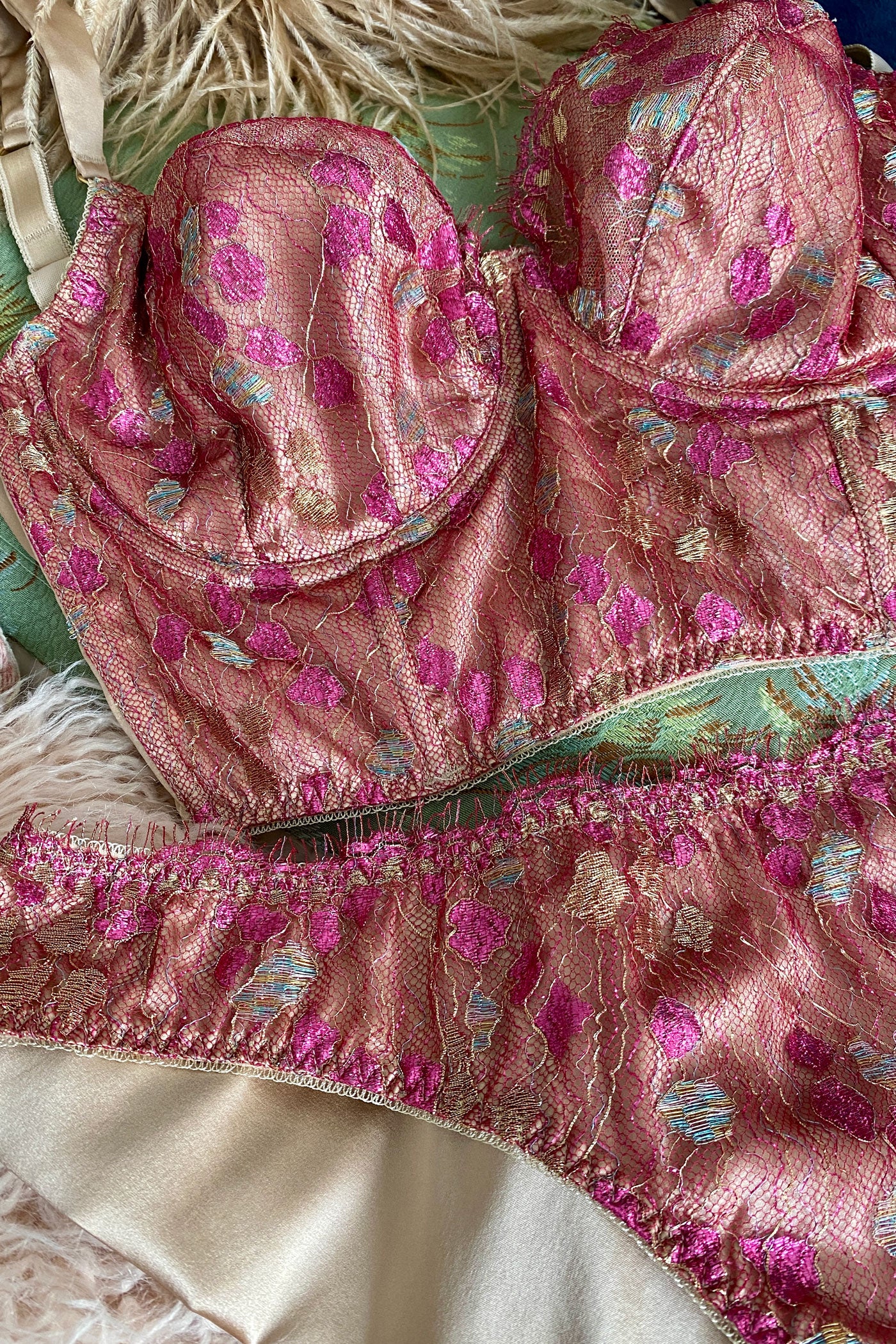 Closeup detail of metallic pink lace on luxury longline bra and silk lined knicker