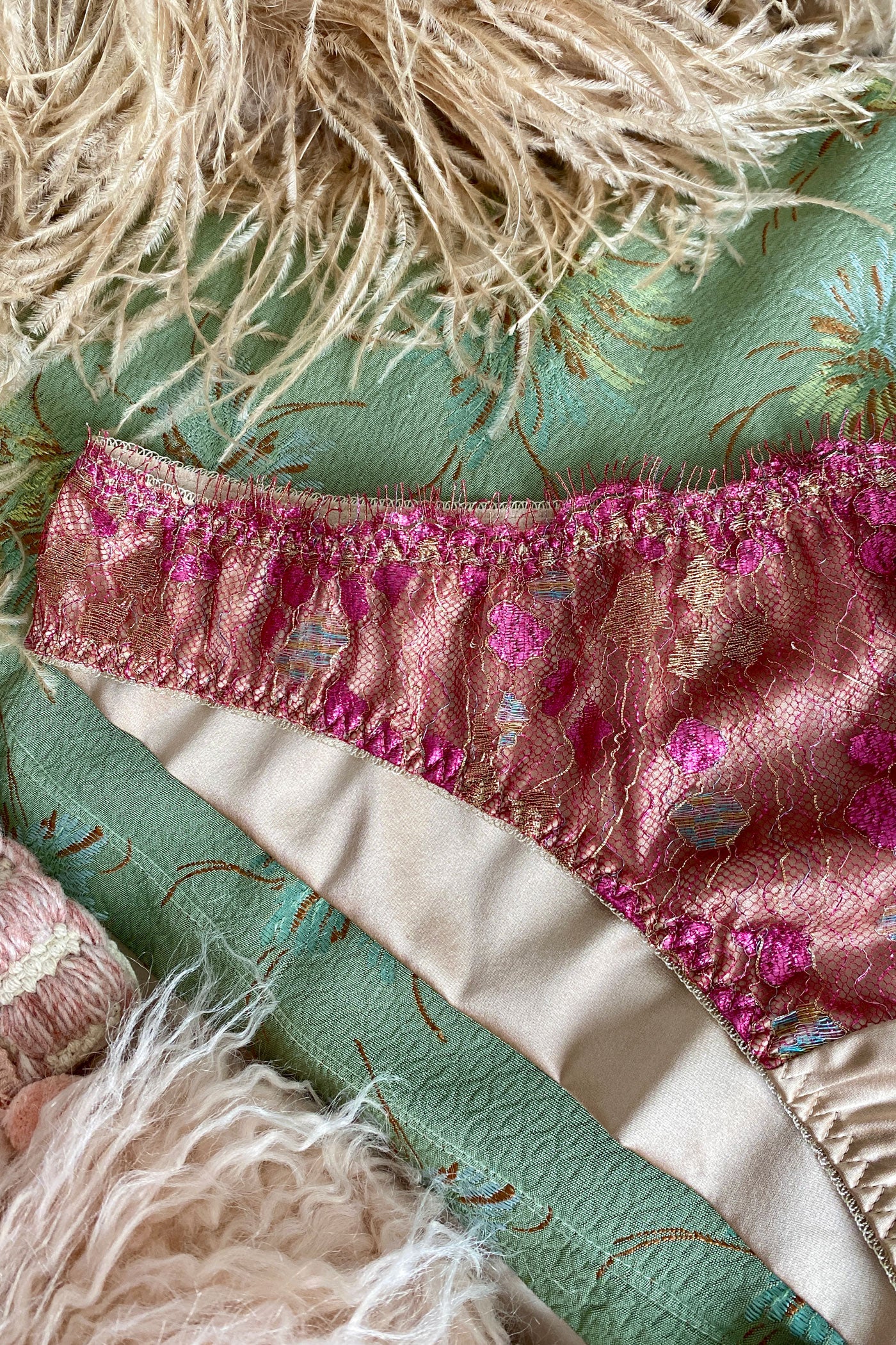 Silk lining detail on luxury pink lace brief