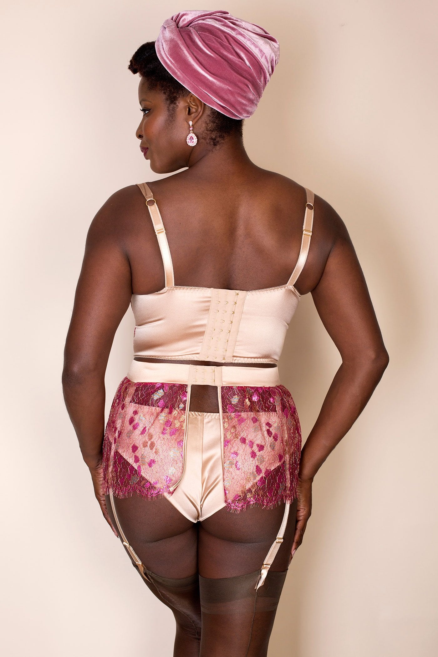Silk lingerie set with matching luxury pink lace garter belt back view