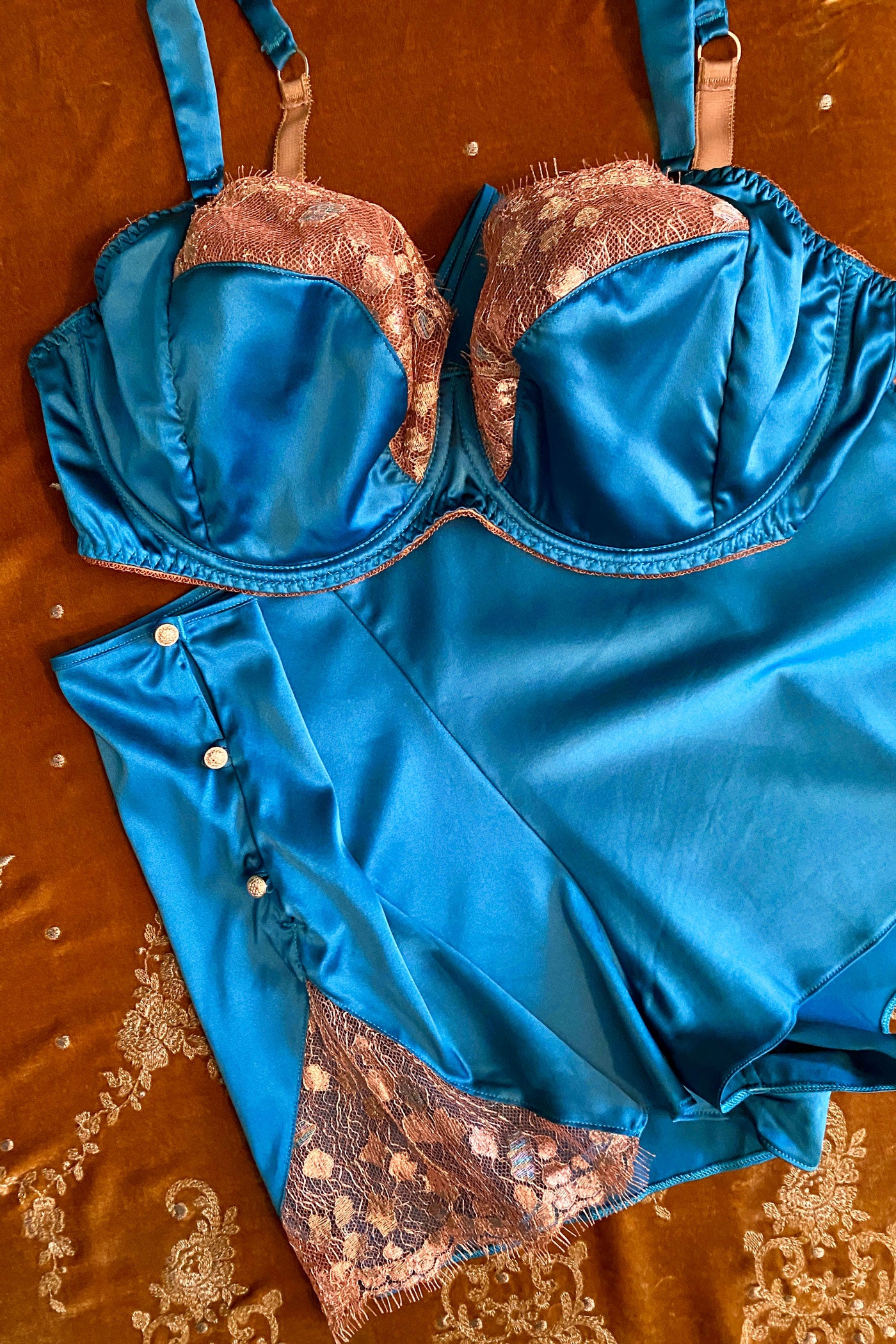 Blue silk bra with metallic gold lace and silk tap pants with gold buttons