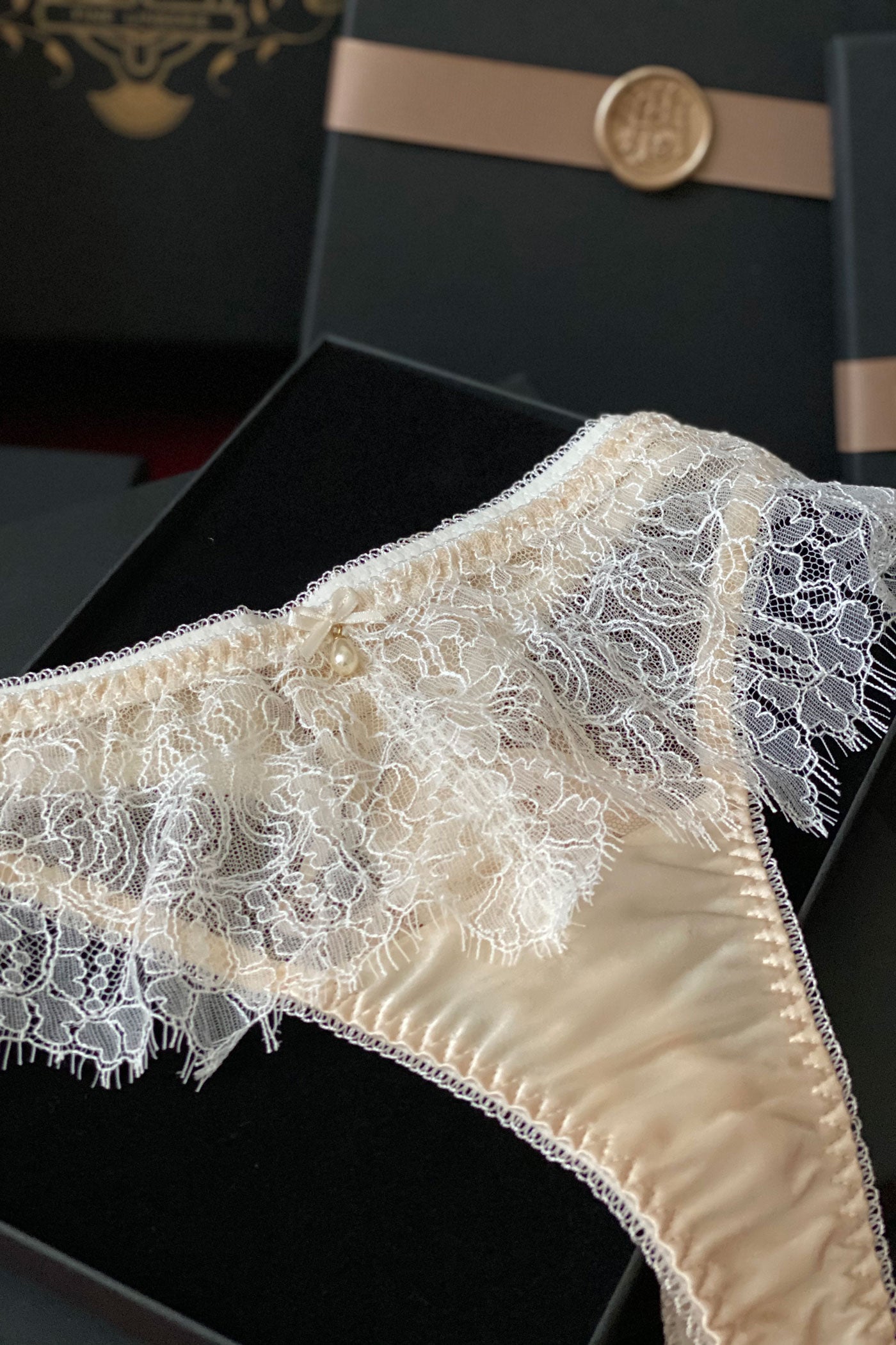 Silk and lace thong in cream and ivory, in velvet lined gift box